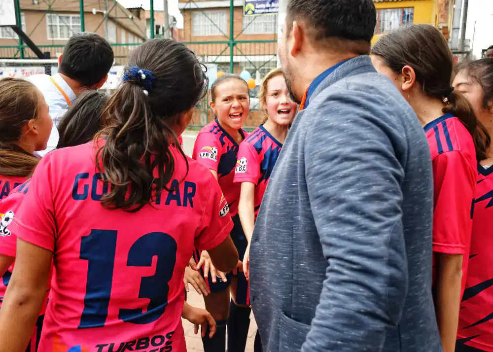 Coach guiding a single player during a match