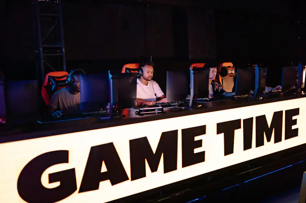 Esports coach analyzing gameplay on screen